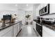 Bright kitchen features granite countertops, stainless steel appliances, and ample cabinet space at 30753 Penny Surf Loop, Wesley Chapel, FL 33545