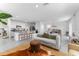 Open-concept living space with tile floors, seamlessly connecting the living room, dining area, and kitchen at 30753 Penny Surf Loop, Wesley Chapel, FL 33545