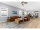 Spacious living room with hardwood floors, recessed lighting, and an open floor plan at 318 Blackrock Ln, Apollo Beach, FL 33572