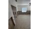 A bedroom needing renovation, with exposed walls and terrazzo flooring at 319 Linden Dr, Ellenton, FL 34222