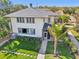 Charming two-story home with lush landscaping and a well-manicured lawn at 330 42Nd S Ave, St Petersburg, FL 33705