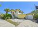 Two-story home with a red back door leading to the upper level at 330 42Nd S Ave, St Petersburg, FL 33705