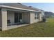 Back porch overlooking the yard, perfect for relaxation and outdoor entertaining at 36562 Silver Maize Dr, Dade City, FL 33525