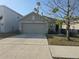 Charming single-Gathering home featuring a two-car garage and well-maintained front yard at 36562 Silver Maize Dr, Dade City, FL 33525