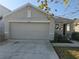 Charming single-Gathering home featuring a two-car garage and well-maintained front yard at 36562 Silver Maize Dr, Dade City, FL 33525