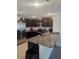 Stylish kitchen boasting granite countertops and stainless steel appliances at 36562 Silver Maize Dr, Dade City, FL 33525