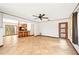 Open-concept living area showcases tile floors and a breakfast bar, connecting seamlessly with the kitchen at 3663 Egerton Cir, Sarasota, FL 34233