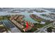 Overhead shot displays condo complex with landscaping and access to water at 406 Sandy Hook Rd, Treasure Island, FL 33706