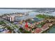 Bird's eye view of condo complex with pool, tennis courts, and scenic harbor view at 406 Sandy Hook Rd, Treasure Island, FL 33706