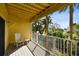 Balcony is ideal for relaxing and enjoying the lush tropical surroundings of this home at 406 Sandy Hook Rd, Treasure Island, FL 33706