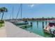 Community boat dock with slips, boat lifts and water access for residents at 406 Sandy Hook Rd, Treasure Island, FL 33706
