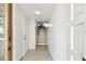 Bright foyer featuring tile flooring, a staircase, and white walls at 406 Sandy Hook Rd, Treasure Island, FL 33706
