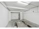 Spacious garage with water heater, white walls, concrete floor, and ample room for parking and storage at 406 Sandy Hook Rd, Treasure Island, FL 33706