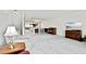 Spacious living room with carpet, natural light, and furniture, offering an inviting space for relaxation and entertainment at 406 Sandy Hook Rd, Treasure Island, FL 33706