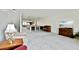 Spacious living room with carpet, natural light, and furniture, offering an inviting space for relaxation and entertainment at 406 Sandy Hook Rd, Treasure Island, FL 33706