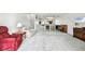 Spacious living room features plush carpet, comfortable seating, and an inviting open floor plan at 406 Sandy Hook Rd, Treasure Island, FL 33706