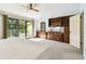 Main bedroom features a ceiling fan, private deck, and built-in storage at 406 Sandy Hook Rd, Treasure Island, FL 33706