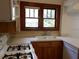 Bright kitchen featuring wooden cabinets, modern appliances, and natural light, creating a functional cooking space at 456 9Th N Ave, St Petersburg, FL 33701