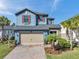 Beautiful two-story home featuring a manicured front lawn and a spacious two-car garage at 4611 San Martino Dr, Wesley Chapel, FL 33543