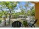 Relaxing balcony with seating overlooking lush greenery, perfect for outdoor enjoyment at 5014 W Lancaster St, Tampa, FL 33616