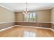 Bright and spacious dining room with hardwood floors and elegant chandelier lighting at 5014 W Lancaster St, Tampa, FL 33616