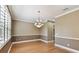 Dining room featuring natural light and hardwood floors, offering ample space for dining at 5014 W Lancaster St, Tampa, FL 33616