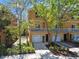Townhome features landscaping, a two car garage and a balcony at 5014 W Lancaster St, Tampa, FL 33616