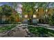 Inviting two-story townhome with an attached one-car garage, balcony, and lush landscaping at 5014 W Lancaster St, Tampa, FL 33616