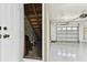 Clean one-car garage with epoxy flooring and door access to the home's interior at 5014 W Lancaster St, Tampa, FL 33616