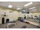 Well equipped fitness center featuring modern exercise equipment and a mirrored wall at 5115 Melbourne St # A303, Port Charlotte, FL 33980