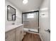 Modern bathroom with stylish vanity, sleek mirror, and a glass-enclosed shower at 5200 Brittany S Dr # 1503, St Petersburg, FL 33715