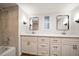 Bathroom features dual vanities with elegant mirrors and modern fixtures at 5200 Brittany S Dr # 1503, St Petersburg, FL 33715