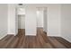 White bedroom showcases hardwood floors and dual closets, maximizing storage space at 5200 Brittany S Dr # 1503, St Petersburg, FL 33715