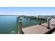 Exterior view of a wooden dock extending into the water with views of waterfront homes at 5200 Brittany S Dr # 1503, St Petersburg, FL 33715
