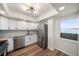 Stainless steel appliances, granite countertops, white cabinets, and wood-look floors make this kitchen shine at 5200 Brittany S Dr # 1503, St Petersburg, FL 33715