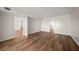 Spacious living room with wood-style flooring and neutral paint at 5200 Brittany S Dr # 1503, St Petersburg, FL 33715