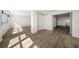 Spacious living area features wood look floors and an ocean view through the large window at 5200 Brittany S Dr # 1503, St Petersburg, FL 33715