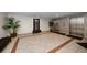 Lobby area with tile flooring, elevators, plants, and bench seating at 5200 Brittany S Dr # 1503, St Petersburg, FL 33715
