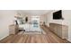 Stylishly furnished bedroom with wood floors, a comfortable bed, and a view to the ocean at 5200 Brittany S Dr # 1503, St Petersburg, FL 33715