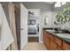 This bathroom features double sinks with a granite countertop and tiled floors at 555 52Nd N Ave, St Petersburg, FL 33703