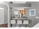 Dining area with counter seating, pendant lights, and modern decor at 555 52Nd N Ave, St Petersburg, FL 33703