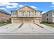 Charming townhome featuring a stone facade, balconies, and three-car garage for ample parking and storage at 555 52Nd N Ave, St Petersburg, FL 33703