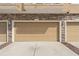Attached home garage featuring neutral color door and stone facade at 555 52Nd N Ave, St Petersburg, FL 33703