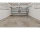 Spacious garage with concrete floors and a white garage door at 555 52Nd N Ave, St Petersburg, FL 33703