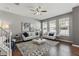 Cozy living room with hardwood floors, modern sofas, and large windows for natural light at 555 52Nd N Ave, St Petersburg, FL 33703
