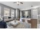 Spacious living area with hardwood floors, access to the dining room, and a cozy sofa at 555 52Nd N Ave, St Petersburg, FL 33703