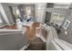 Open-concept living space with dining area, stairs, and access to the outdoors at 555 52Nd N Ave, St Petersburg, FL 33703