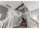 Carpeted staircase with white railings, leading to upper level at 555 52Nd N Ave, St Petersburg, FL 33703