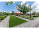 Well-maintained lawn with seating areas and landscaping provides relaxing outdoor communal place at 6002 Thrushwood Rd, Lithia, FL 33547