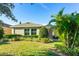 Charming home with a neatly manicured lawn and a screened patio at 6002 Thrushwood Rd, Lithia, FL 33547
